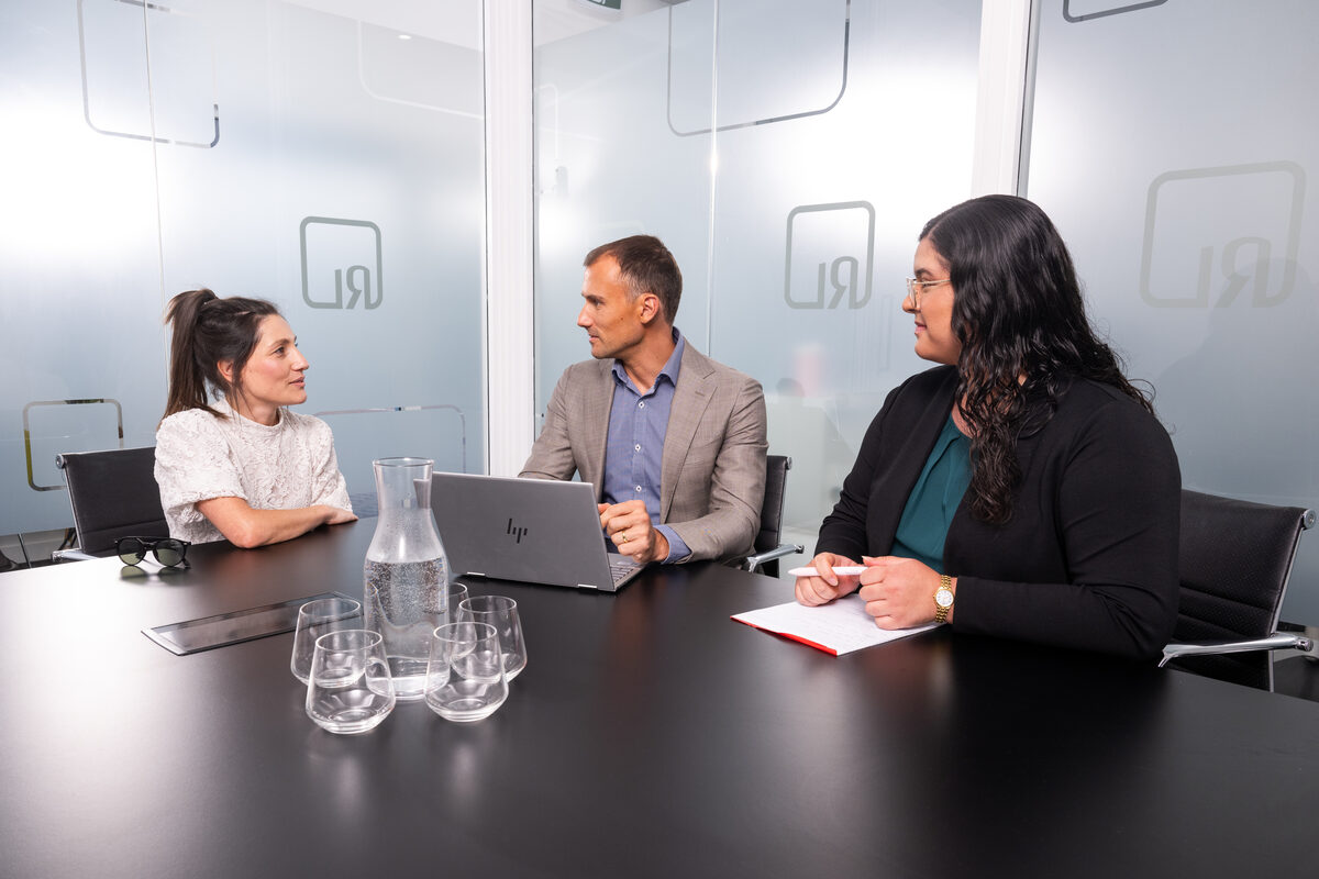 Rogalski Lawyers compensation lawyers meeting clients in the firm's boardroom